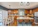 Spacious eat-in kitchen with a large island, granite countertops, and stainless-steel appliances at 9675 E 105Th Ave, Commerce City, CO 80640