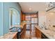 Well-appointed kitchen with sleek appliances, ample counter space, and stylish cabinetry at 9675 E 105Th Ave, Commerce City, CO 80640