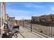 Inviting balcony with outdoor seating and a cozy fire pit, perfect for entertaining at 9225 Rockhurst St # A, Highlands Ranch, CO 80129