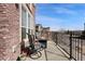 Charming balcony with outdoor seating and a cozy fire pit, perfect for entertaining at 9225 Rockhurst St # A, Highlands Ranch, CO 80129