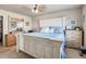 Comfortable bedroom with wooden furniture, a ceiling fan and blue bedding for a relaxing atmosphere at 9225 Rockhurst St # A, Highlands Ranch, CO 80129