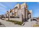 Charming townhome with brick and stucco exterior, featuring a cozy front porch and well-maintained landscaping at 9225 Rockhurst St # A, Highlands Ranch, CO 80129