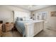 Spacious main bedroom featuring a large bed, nightstands, and ample natural light from a window at 9225 Rockhurst St # A, Highlands Ranch, CO 80129
