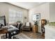 Bright home office with hardwood floors, desk, chair, and decorative bookcase at 9225 Rockhurst St # A, Highlands Ranch, CO 80129