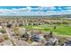 Charming home with lush green landscape, and golf course views in the background at 17280 W 70Th Ave, Arvada, CO 80007