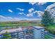Scenic view from the back of the property featuring landscaping, open fields, and distant mountains at 17280 W 70Th Ave, Arvada, CO 80007
