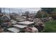 Landscaped backyard with beautiful stone stairs, boulders, and mature trees at 17280 W 70Th Ave, Arvada, CO 80007