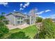 This home features a spacious backyard with a lush lawn and mature landscaping, creating a private outdoor oasis at 17280 W 70Th Ave, Arvada, CO 80007