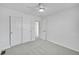 Bright bedroom offers a ceiling fan, neutral paint, carpet and closet space, perfect for relaxation and storage at 17280 W 70Th Ave, Arvada, CO 80007