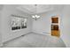 Bright dining room with chandelier and view of the kitchen at 17280 W 70Th Ave, Arvada, CO 80007