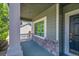 Charming front porch detail with stone accents, a view of the neighborhood at 17280 W 70Th Ave, Arvada, CO 80007