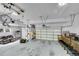 Spacious garage with multiple doors, ample storage, and room for vehicles and equipment at 17280 W 70Th Ave, Arvada, CO 80007