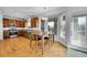 Open-concept kitchen with a view into the dining area with backyard views and lots of natural light at 17280 W 70Th Ave, Arvada, CO 80007