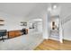 Bright living room with a vaulted ceiling, built-in desk, and adjacent dining area at 17280 W 70Th Ave, Arvada, CO 80007