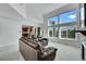 Bright and open living room with high ceilings, abundant natural light, and a view of the backyard at 17280 W 70Th Ave, Arvada, CO 80007