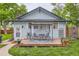 Charming back deck with a canopy, outdoor seating, and flower pots, perfect for relaxation at 3396 S Logan St, Englewood, CO 80113