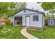 Quaint backyard with a bar and outdoor seating and a storage shed at 3396 S Logan St, Englewood, CO 80113