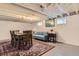 Finished basement with a sitting area, dining table, and modern decor at 3396 S Logan St, Englewood, CO 80113