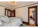 Serene bedroom showcasing doorways, neutral decor, and carpeted floors at 3396 S Logan St, Englewood, CO 80113