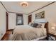 Comfortable bedroom featuring hardwood floors, picture window, and classic design elements at 3396 S Logan St, Englewood, CO 80113