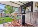 Stylish garage bar with a view of the landscaped backyard and lush greenery at 3396 S Logan St, Englewood, CO 80113
