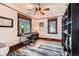 Cozy office space featuring hardwood floors, a ceiling fan, and bright natural light at 3396 S Logan St, Englewood, CO 80113