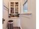 Convenient pantry boasts ample storage with shelves, cabinets, and a trash receptacle at 3396 S Logan St, Englewood, CO 80113