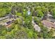 Lush trees surround this property in this aerial view, offering great shade and privacy at 8600 W 2Nd Ave, Lakewood, CO 80226