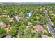 A bird's eye view captures the verdant setting of this residence nestled among mature trees and landscaping at 8600 W 2Nd Ave, Lakewood, CO 80226