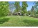 Expansive backyard with lush lawn, mature trees, and inviting outdoor spaces at 8600 W 2Nd Ave, Lakewood, CO 80226