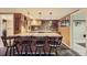 Finished basement bar with granite countertops, barstools, and stone backsplash at 8600 W 2Nd Ave, Lakewood, CO 80226