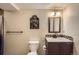 Charming bathroom with stylish vanity, mirror, and decorative Guinness sign at 8600 W 2Nd Ave, Lakewood, CO 80226