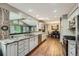 Modern kitchen with granite countertops, stainless steel appliances, and hardwood floors at 8600 W 2Nd Ave, Lakewood, CO 80226