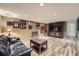 Finished basement living room with modern flooring, comfortable seating, and entertainment center at 8600 W 2Nd Ave, Lakewood, CO 80226