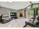Cozy living room with a stone fireplace, large windows, and comfortable seating at 8600 W 2Nd Ave, Lakewood, CO 80226