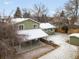 Aerial view of a home showcasing the backyard, patio and lawn at 3293 S Fairplay St, Aurora, CO 80014