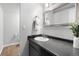 Bathroom featuring a modern sink, dark countertops, and tile floors at 3293 S Fairplay St, Aurora, CO 80014