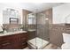 Bathroom featuring a walk-in glass shower and modern vanity at 3293 S Fairplay St, Aurora, CO 80014