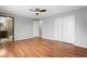 Bedroom featuring hardwood floors, an ensuite bath, and a closet at 3293 S Fairplay St, Aurora, CO 80014