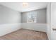 Bright bedroom with neutral carpet, white walls and trim, and a window with natural light at 3293 S Fairplay St, Aurora, CO 80014