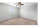 Bedroom featuring carpet flooring and a large window at 3293 S Fairplay St, Aurora, CO 80014