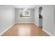 Dining area with hardwood floors, ample natural light, and contemporary lighting fixture at 3293 S Fairplay St, Aurora, CO 80014