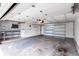 Spacious garage with ample shelving and storage, and a workbench area at 3293 S Fairplay St, Aurora, CO 80014