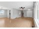 Bright and airy living room featuring hardwood floors, neutral walls, and a ceiling fan at 3293 S Fairplay St, Aurora, CO 80014