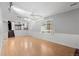 Bright living room with large windows, hardwood floors, and wainscoting at 3293 S Fairplay St, Aurora, CO 80014