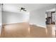 Spacious living room with hardwood floors, neutral paint, and a ceiling fan at 3293 S Fairplay St, Aurora, CO 80014