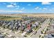 Aerial view of a neighborhood showcasing a well-planned community and proximity to open land and mountain views at 26385 E Canal Pl, Aurora, CO 80018