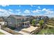 Aerial view of backyard with a large concrete patio and lush landscaping at 26385 E Canal Pl, Aurora, CO 80018