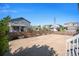 Large backyard featuring a spacious patio with wooden fence perimeter at 26385 E Canal Pl, Aurora, CO 80018