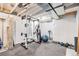 Workout area in the basement with modern equipment and rubber flooring at 26385 E Canal Pl, Aurora, CO 80018